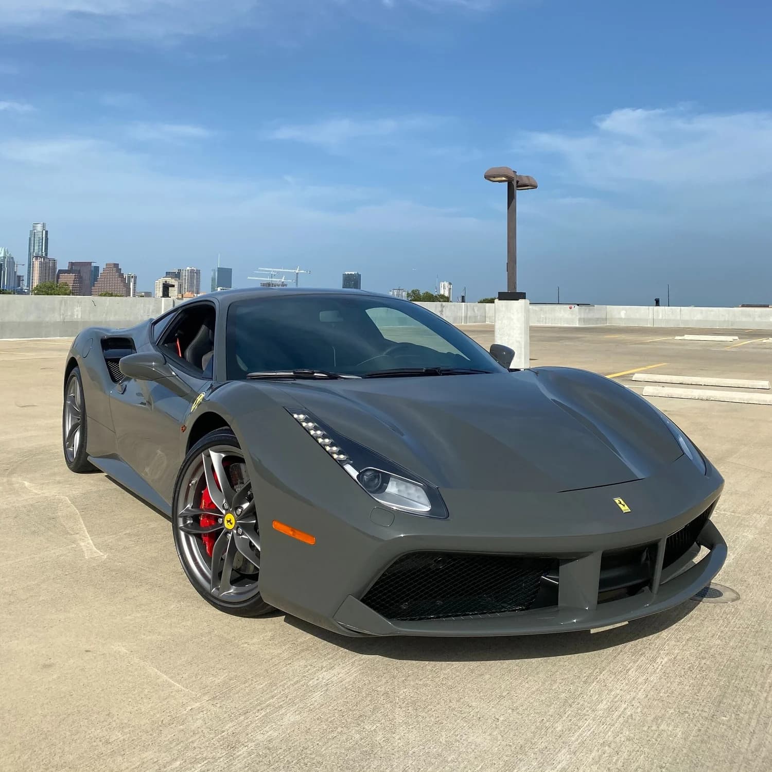 Gray Ferrari 488 detailed, Austin skyline
